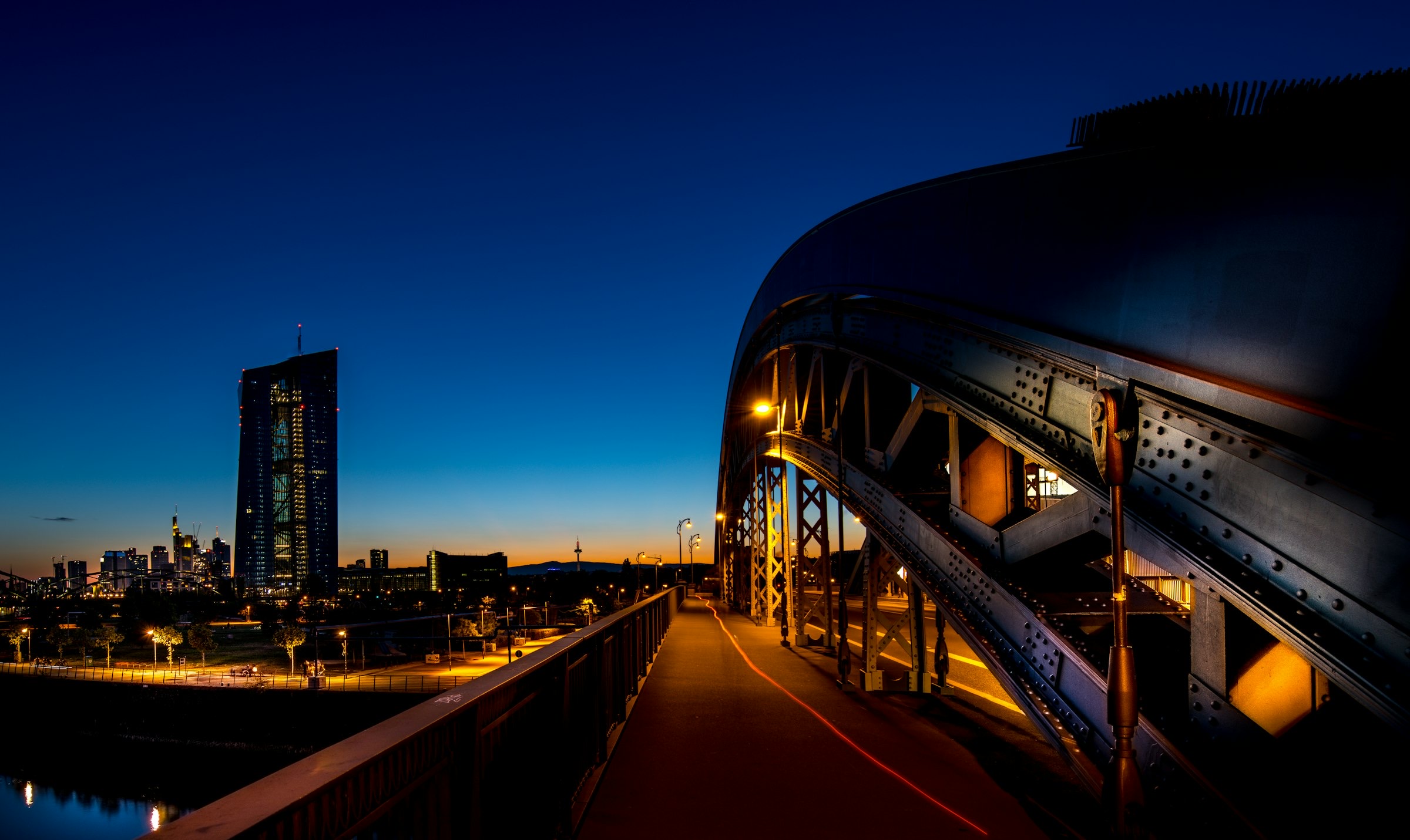 Editorial portrait of a global container terminal at dusk, signaling international trade scale
